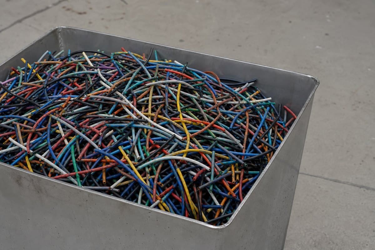 Cut lengths of stripped data cable recovered from decommissioned IT equipment