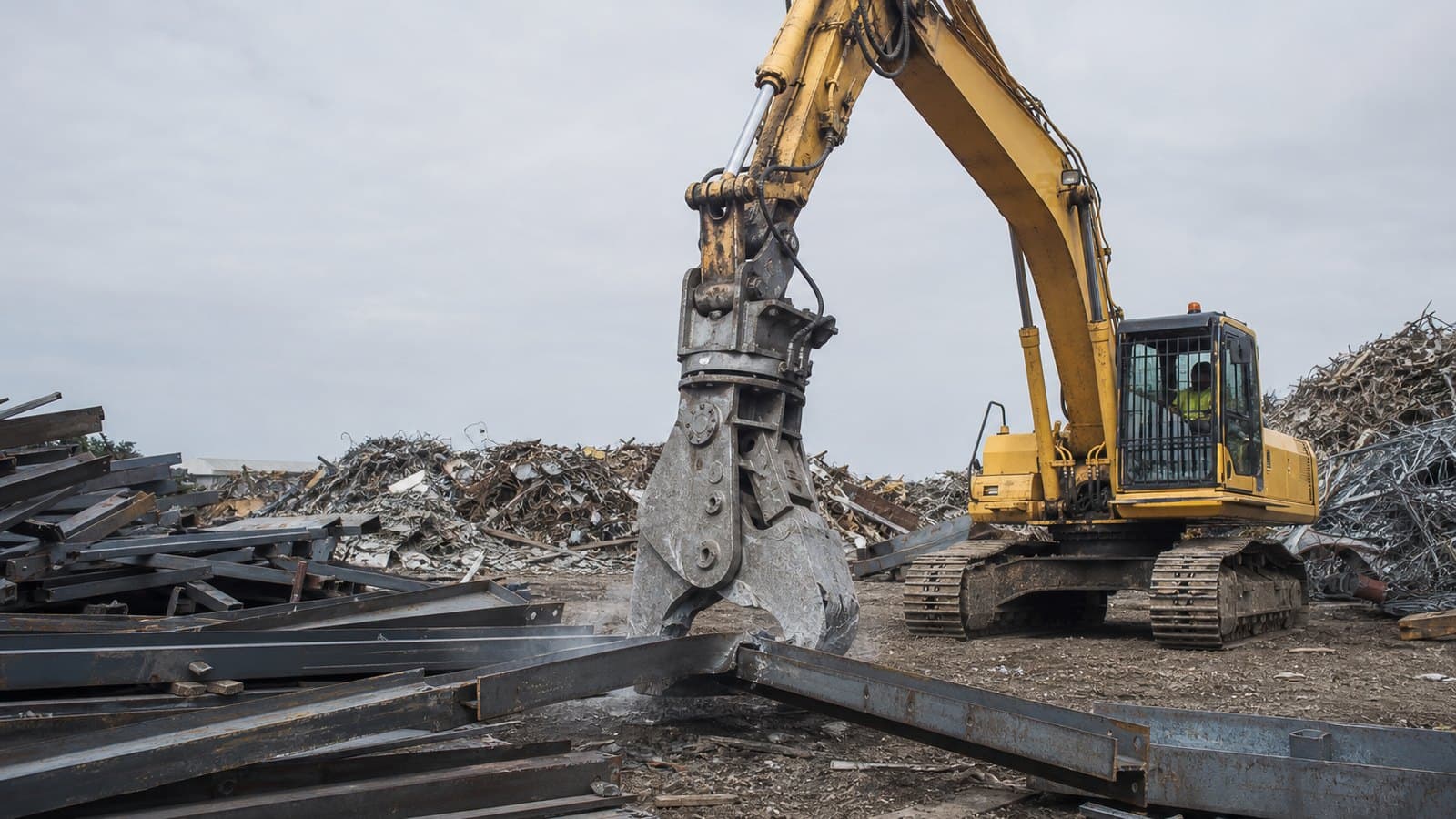 A mobile shear processing steel on a customer site