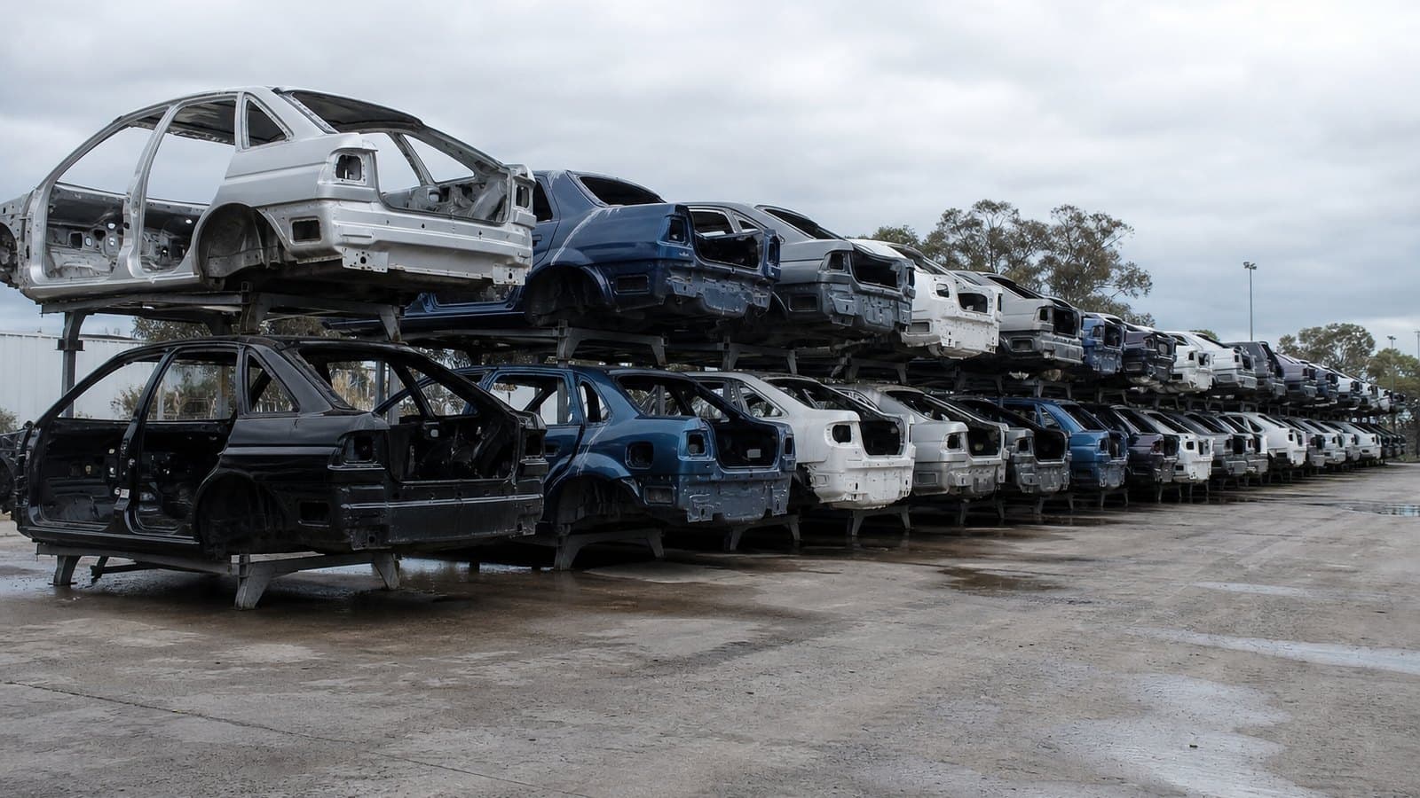 End-of-life vehicles stacked at a depollution yard